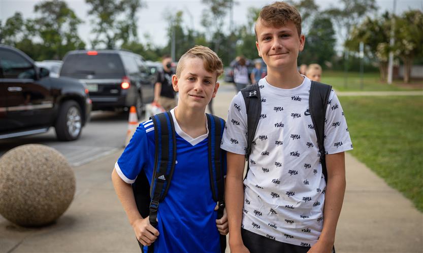 Two boys smile